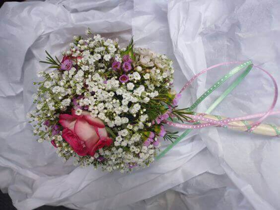 Childs flower wand, gypsophila and roses